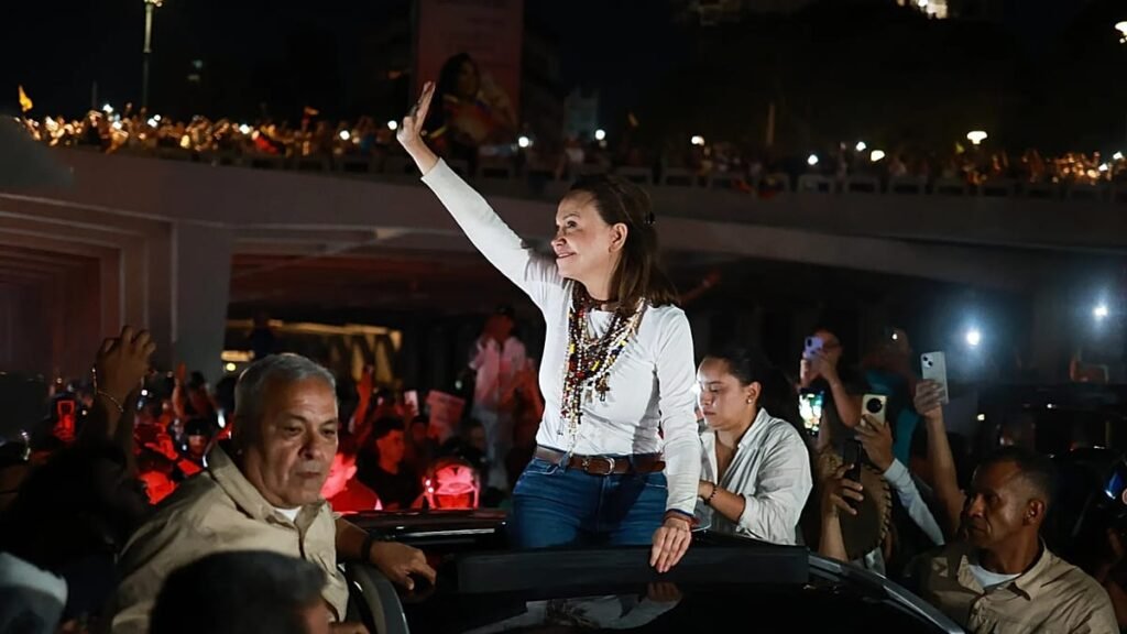 Maria Corina Machado Pushes for Transparent Talks After Return Maria Corina Machado greeting supporters in Caracas
